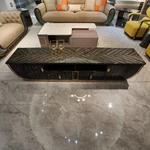 Modern Luxury Black Wood TV Stand with Curved Silhouette, Geometric Veneer Top and Brushed Gold Metal Accents